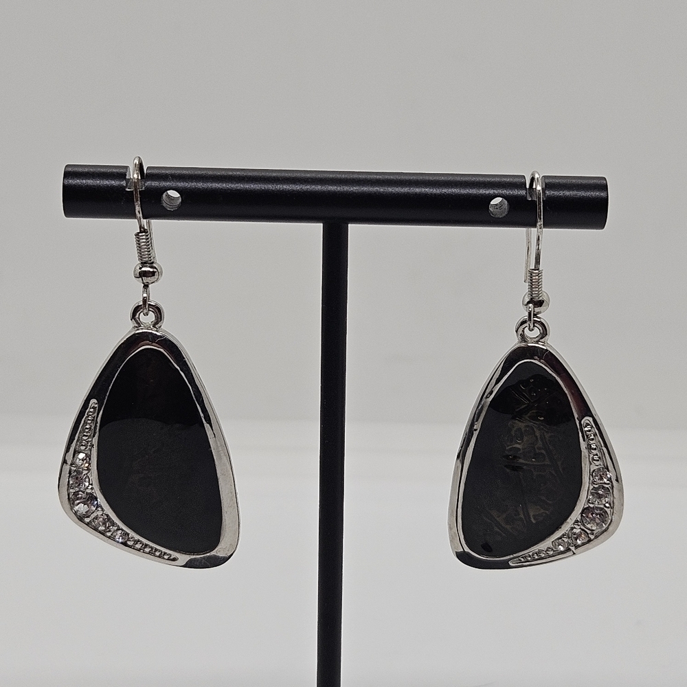 silver tone asymmetric dangle earrings with rhinestones and green-black enamel